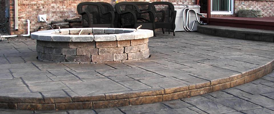 stamped concrete patio with intigrated firepit